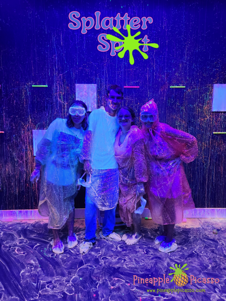 A family covered in glowing paint