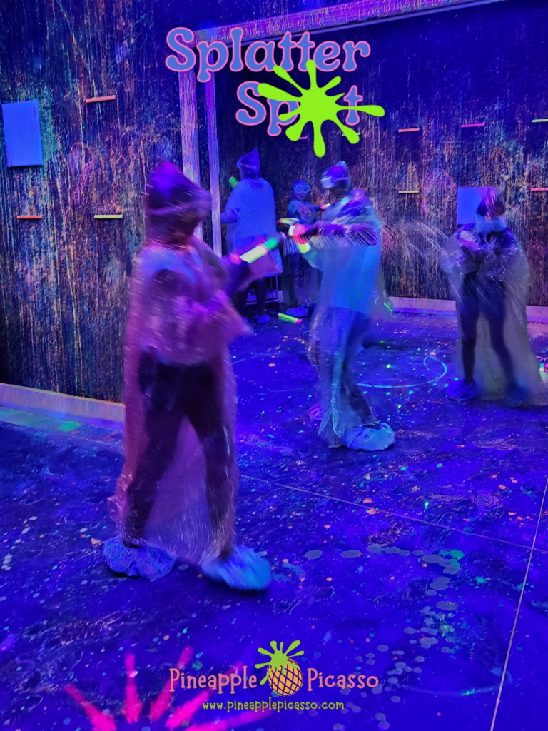 Guests in ponchos in the Splatter Spot